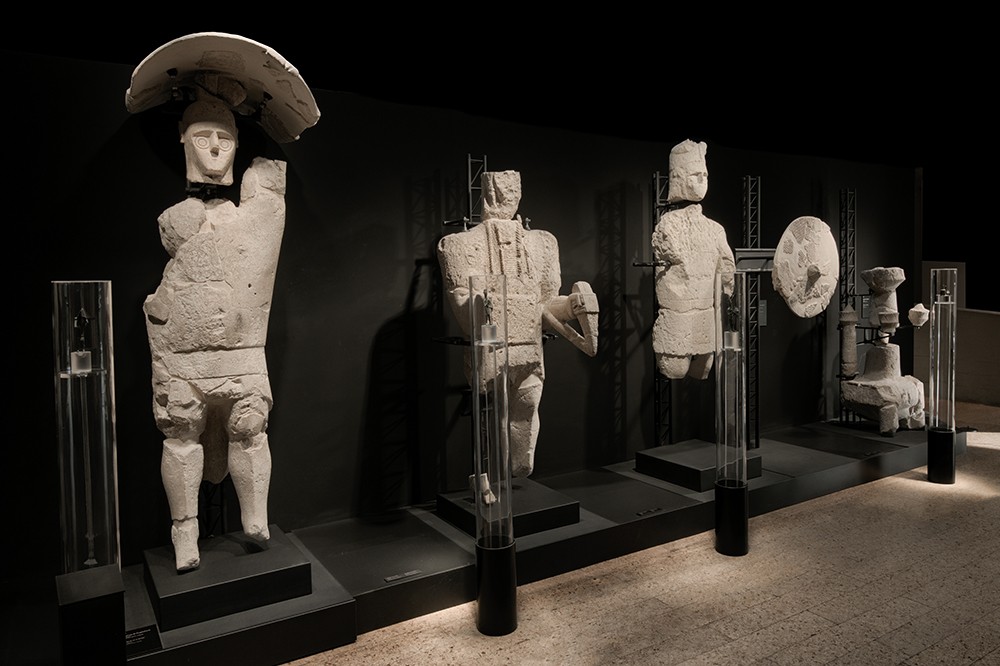 Statues of youths, archers, and warriors